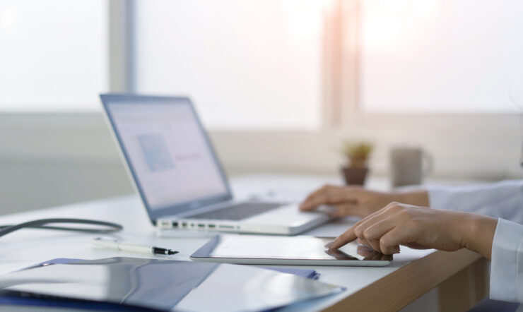 A person writing on a computer